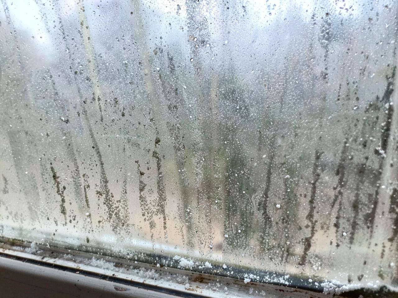 Dirty window glass with hard water spots and buildup